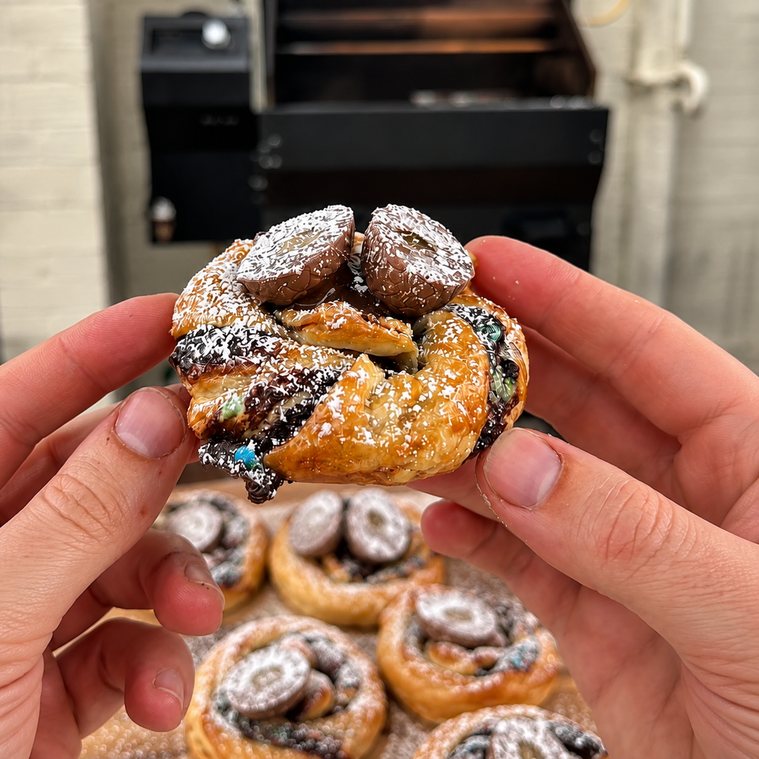 Smoked Easter puff pastry swirls filled with Nutella and Peanut M&M's topped with Mini Creme Eggs
